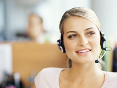 close-up of a businesswoman wearing a headset in an office