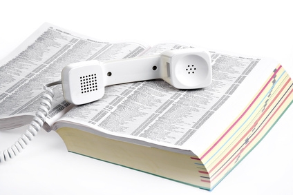 old style phone over yellow book